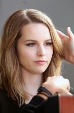 BRIDGIT MENDLER on the Set of Extra in Los Angles