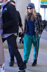 CARA DELEVINGNE at JFK Airport in New York 04/25/2015