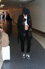 CARA DELEVINGNE at Los Angeles International Airport