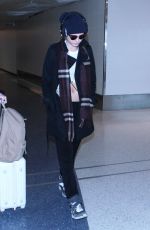 CARA DELEVINGNE at Los Angeles International Airport