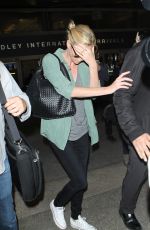 CHARLIZE THERON Arrives at LAX Airport in Los Angeles