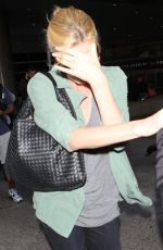 CHARLIZE THERON Arrives at LAX Airport in Los Angeles