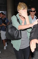 CHARLIZE THERON Arrives at LAX Airport in Los Angeles