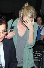 CHARLIZE THERON Arrives at LAX Airport in Los Angeles