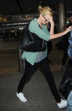 CHARLIZE THERON Arrives at LAX Airport in Los Angeles