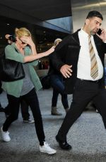 CHARLIZE THERON Arrives at LAX Airport in Los Angeles