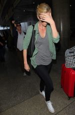 CHARLIZE THERON Arrives at LAX Airport in Los Angeles