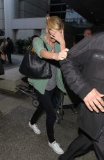 CHARLIZE THERON Arrives at LAX Airport in Los Angeles