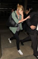 CHARLIZE THERON Arrives at LAX Airport in Los Angeles