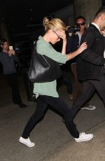 CHARLIZE THERON Arrives at LAX Airport in Los Angeles