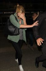 CHARLIZE THERON Arrives at LAX Airport in Los Angeles