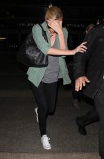 CHARLIZE THERON Arrives at LAX Airport in Los Angeles