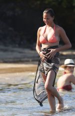 CHRISSY TEIGEN in Bikini on the Beach in The Caribbean