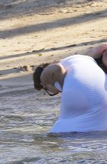 CHRISSY TEIGEN in Bikini on the Beach in The Caribbean