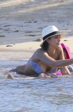 CHRISSY TEIGEN in Bikini on the Beach in The Caribbean
