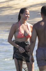 CHRISSY TEIGEN in Bikini on the Beach in The Caribbean