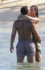 CHRISSY TEIGEN in Bikini on the Beach in The Caribbean