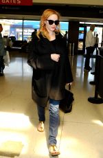 CHRISTINA HENDRICKS Arrives at Los Angeles International Airport