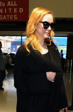 CHRISTINA HENDRICKS Arrives at Los Angeles International Airport