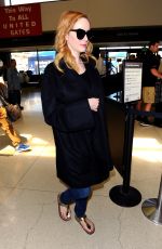 CHRISTINA HENDRICKS Arrives at Los Angeles International Airport