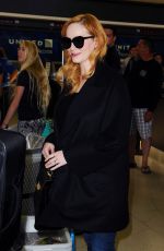 CHRISTINA HENDRICKS Arrives at Los Angeles International Airport