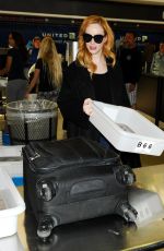CHRISTINA HENDRICKS Arrives at Los Angeles International Airport