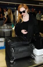 CHRISTINA HENDRICKS Arrives at Los Angeles International Airport