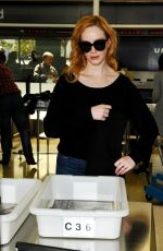 CHRISTINA HENDRICKS Arrives at Los Angeles International Airport