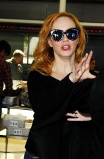 CHRISTINA HENDRICKS Arrives at Los Angeles International Airport