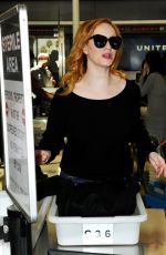 CHRISTINA HENDRICKS Arrives at Los Angeles International Airport