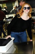 CHRISTINA HENDRICKS Arrives at Los Angeles International Airport