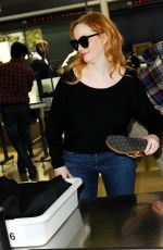 CHRISTINA HENDRICKS Arrives at Los Angeles International Airport