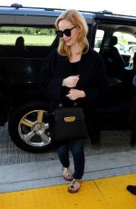 CHRISTINA HENDRICKS Arrives at Los Angeles International Airport