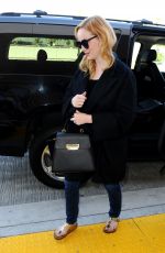 CHRISTINA HENDRICKS Arrives at Los Angeles International Airport