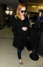 CHRISTINA HENDRICKS Arrives at Los Angeles International Airport