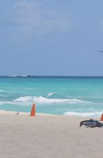 CLAUDIA ROMANI in Bikini Playing with a Dron on the Beach in Miami