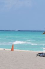 CLAUDIA ROMANI in Bikini Playing with a Dron on the Beach in Miami