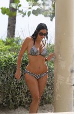 CLAUDIA ROMANI in Bikini Taking a Shower in Miami