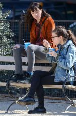 DAKOTA JOHNSON Out with Her Dog at a Park in New York