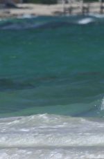 EMILY CAMP in Bikini at a Beach in Cancun