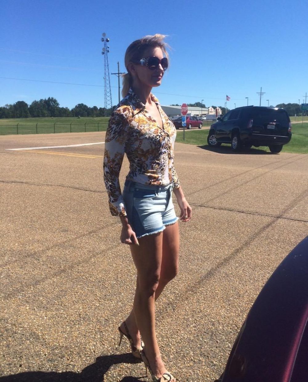 FAITH HILL in Denim Shorts on the Set of her New Movie Dixieland