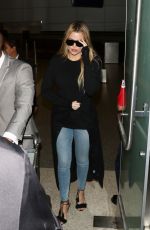 KHLOE KARDASHIAN in Jeans at LAX Airport in Los Angeles