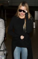 KHLOE KARDASHIAN in Jeans at LAX Airport in Los Angeles