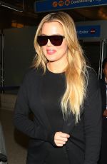 KHLOE KARDASHIAN in Jeans at LAX Airport in Los Angeles