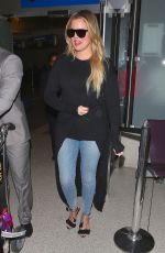 KHLOE KARDASHIAN in Jeans at LAX Airport in Los Angeles