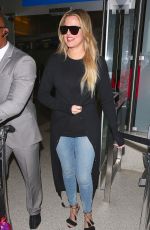 KHLOE KARDASHIAN in Jeans at LAX Airport in Los Angeles