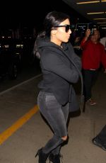KIM KARDASHIAN Arrives at LAX Airport in Los Angeles 04/20/2015