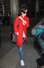 LILY COLLINS Arrives at Los Angeles International Airport