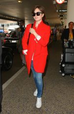 LILY COLLINS Arrives at Los Angeles International Airport
