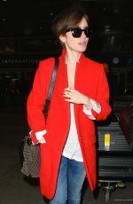 LILY COLLINS Arrives at Los Angeles International Airport